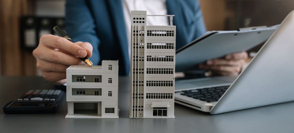 Illustrative photograph of building models on a property manager's desk